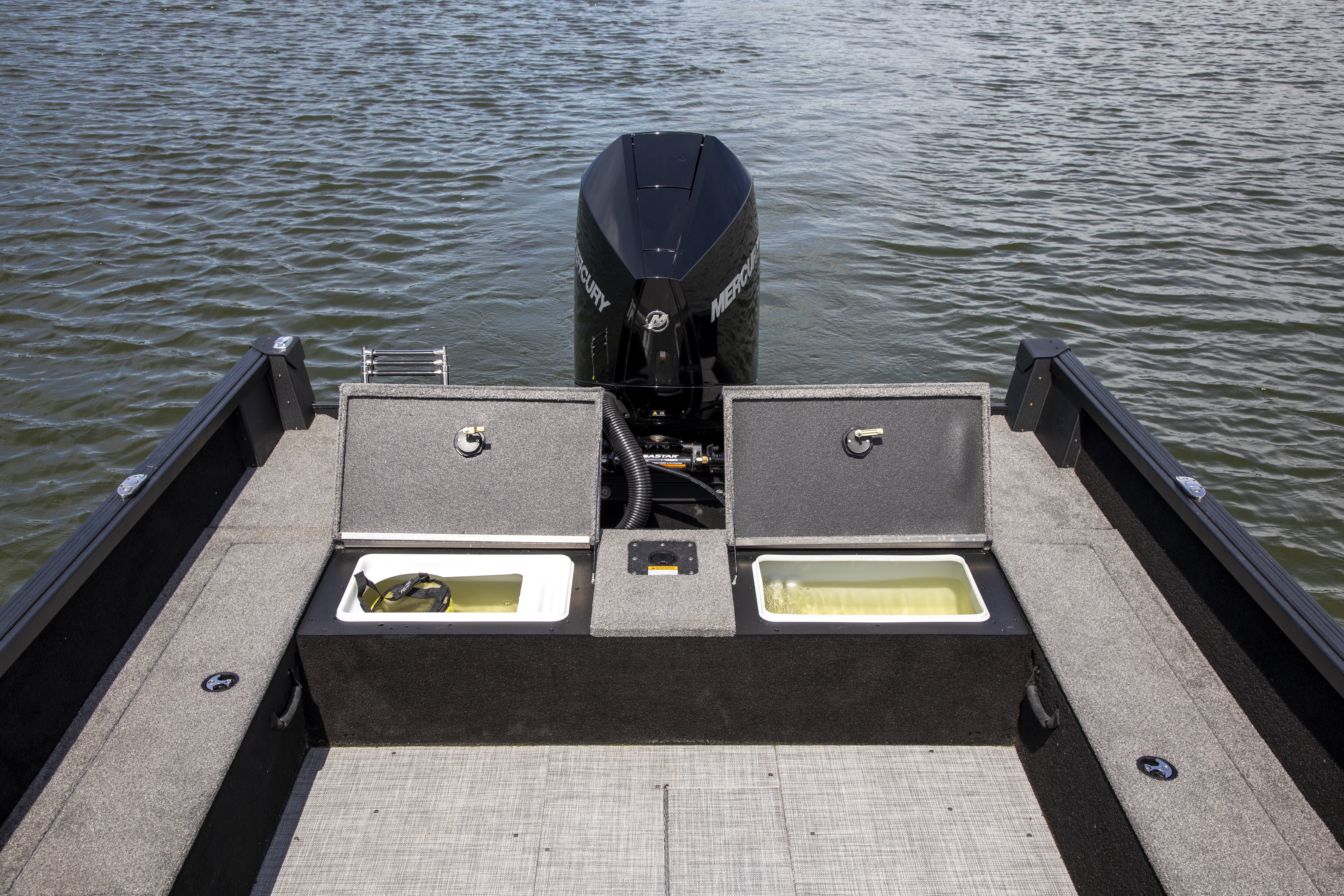 Man with his son fishing from an Alumacraft aluminum fishing boat