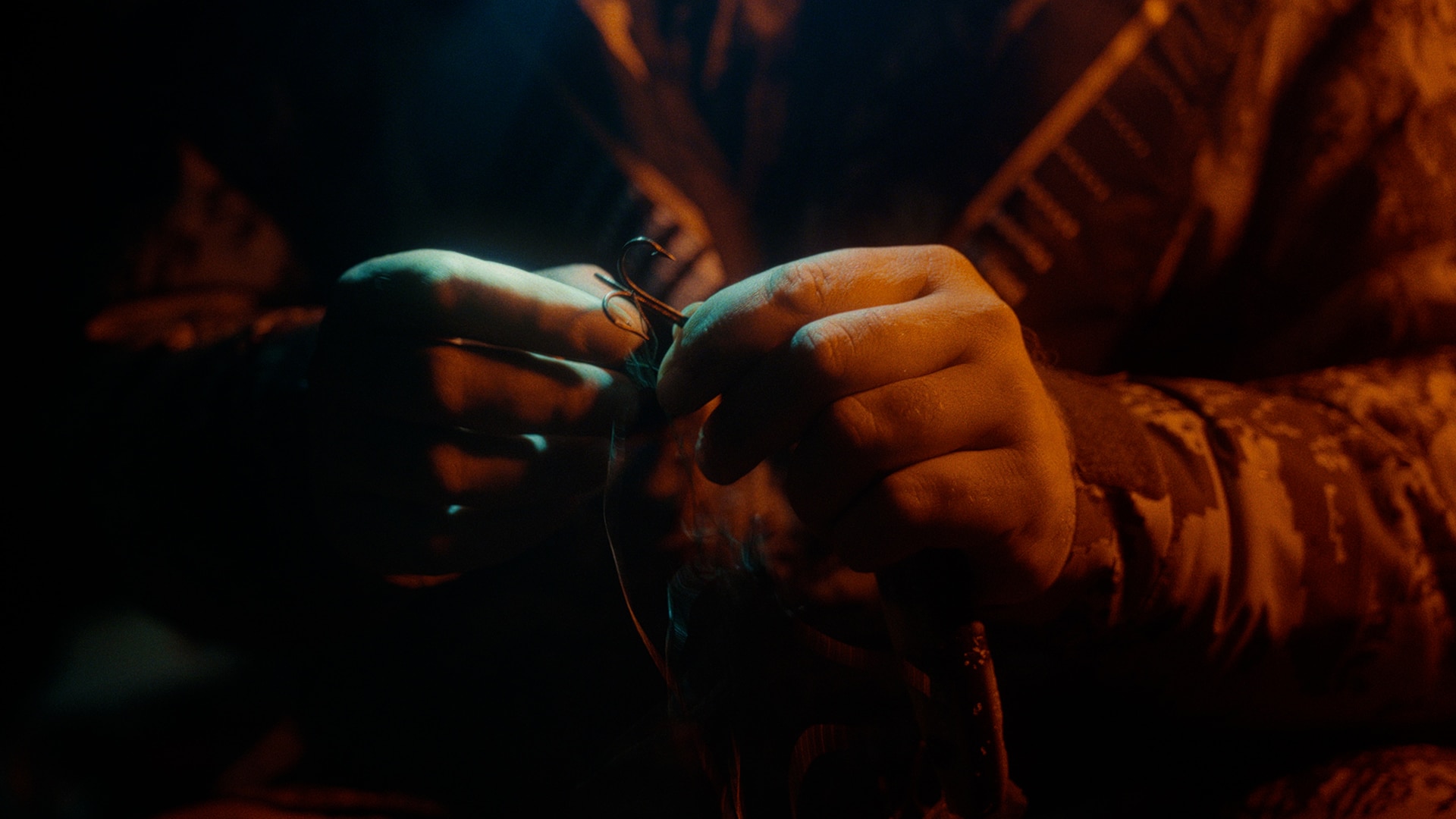 Close-up of Ramsell's hands as he crafts his hook
