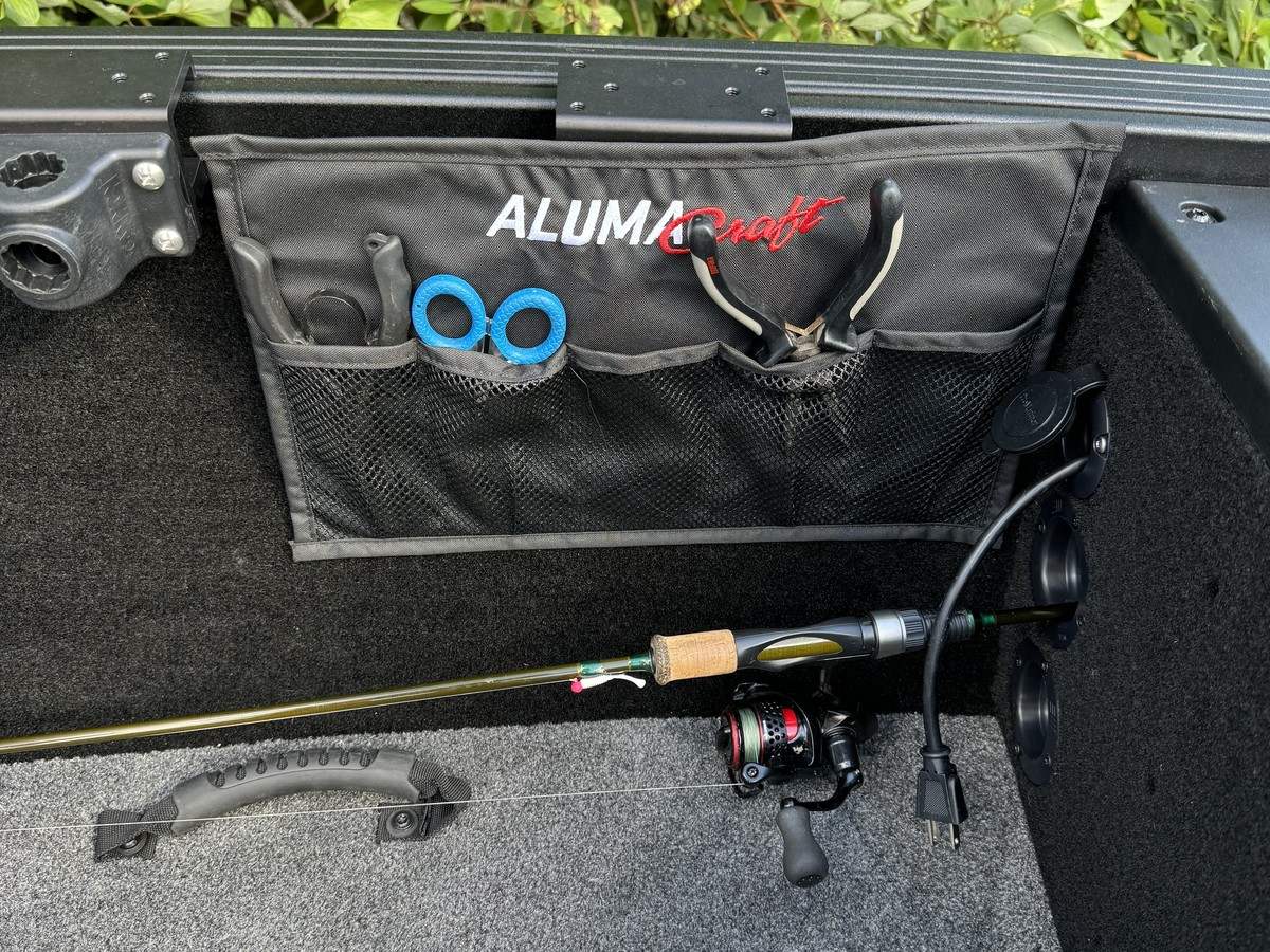 Fishing tools arranged in an Alumacraft boat