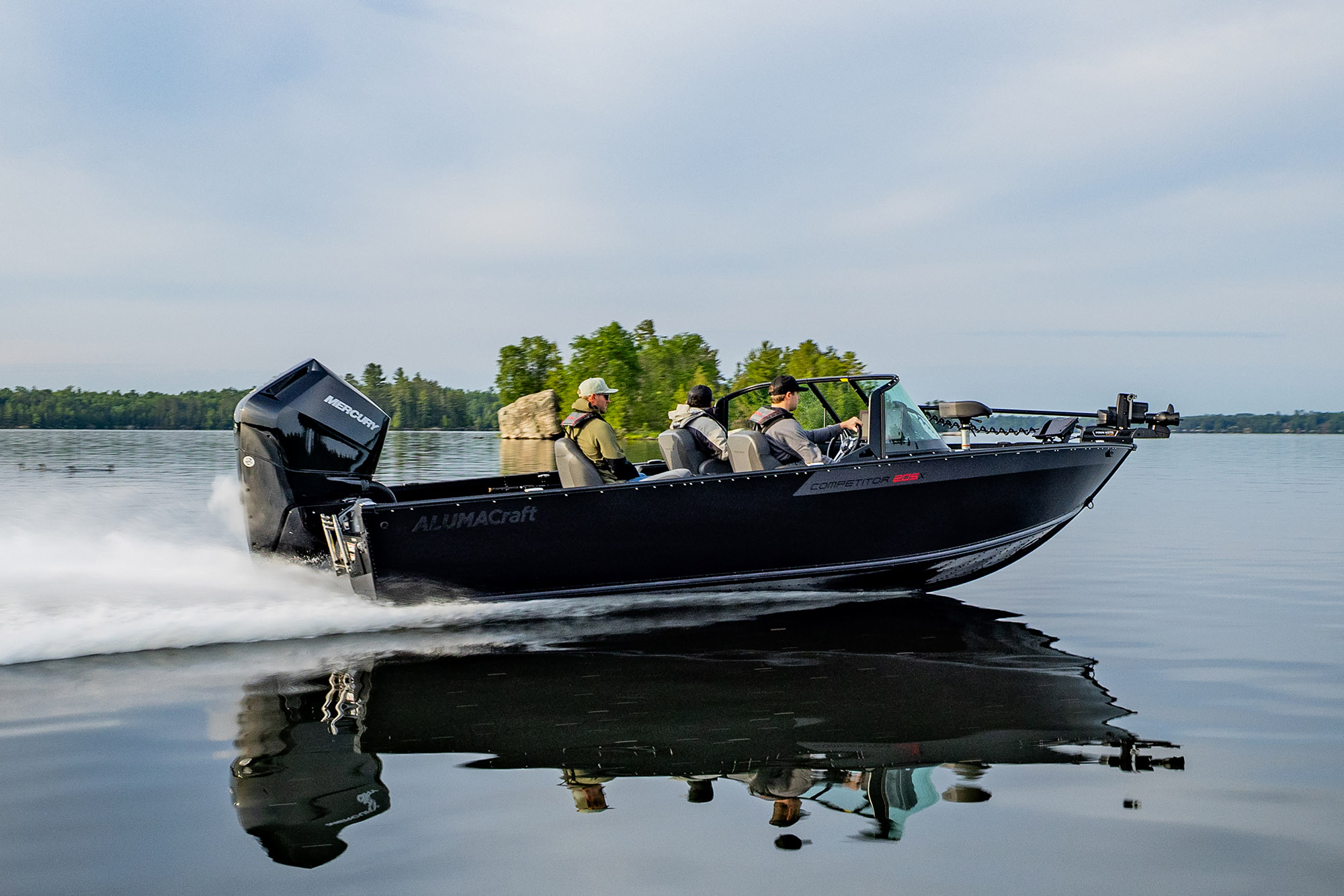 Man with his son fishing from an Alumacraft aluminum fishing boat